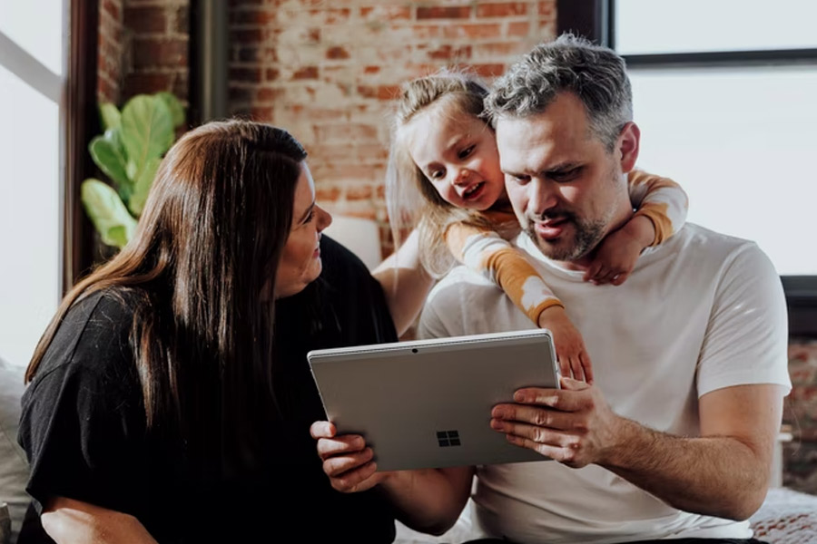 Young family using computer